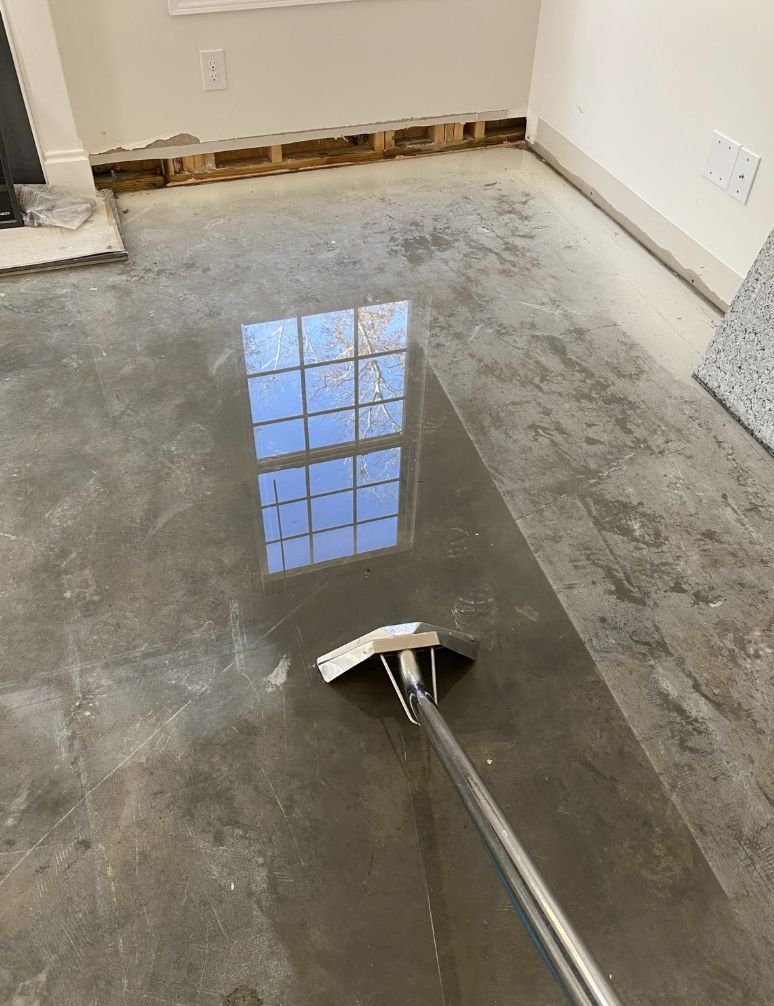 Water extraction wand on a Charlotte NC home's subfloor during structural drying